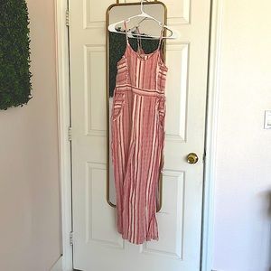 Only worn 2 times. Red and white striped jumpsuit. It has pockets.